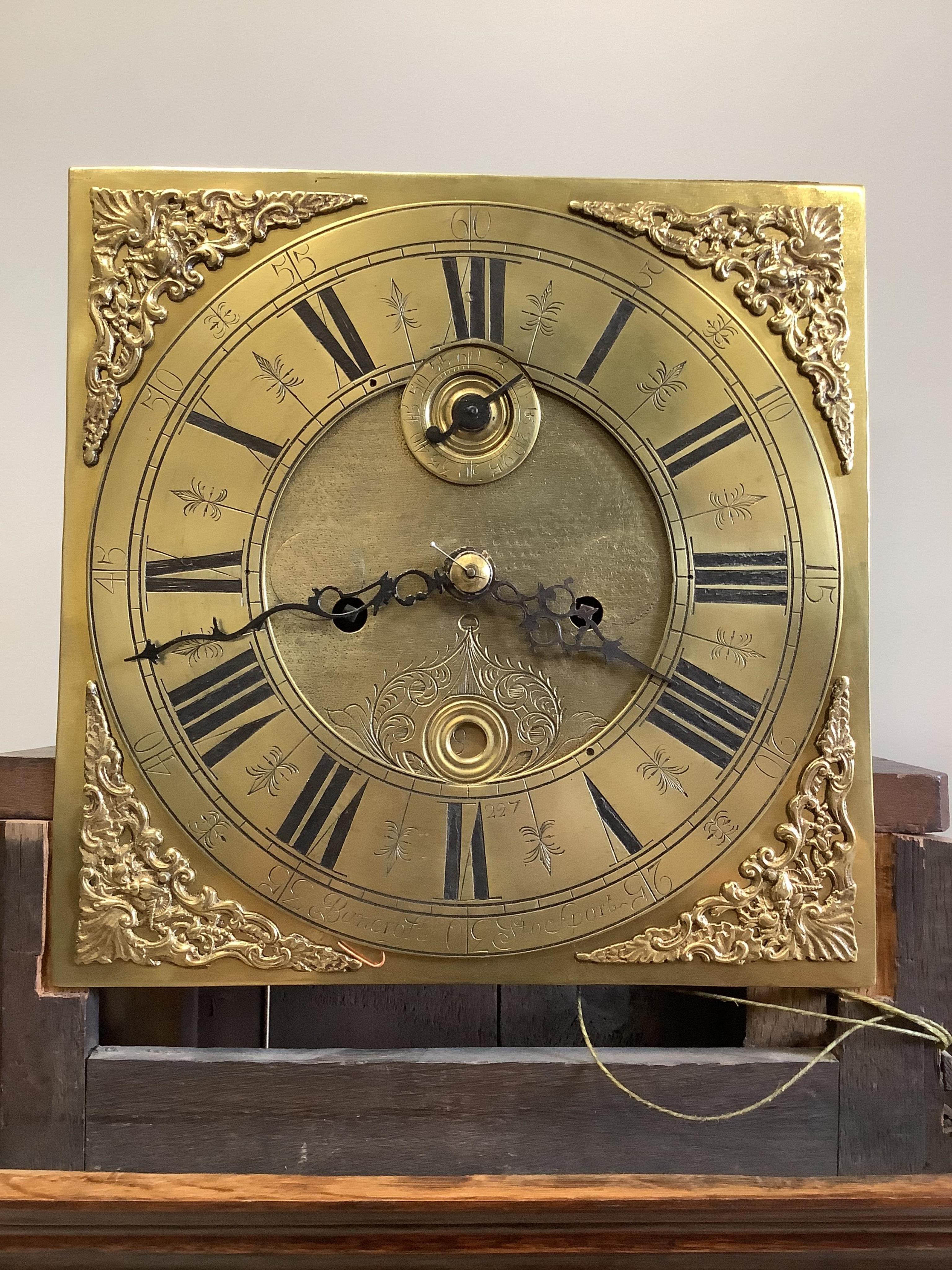 An 18th century oak eight day longcase clock, the 11in. brass dial marked Bancroft, Stockport, height 190cm. Condition - good